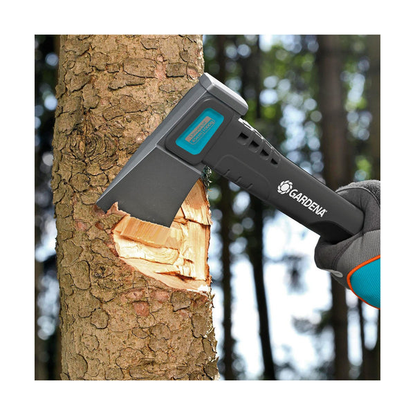 Gardena tree pruner being used on a tree trunk with a forest background