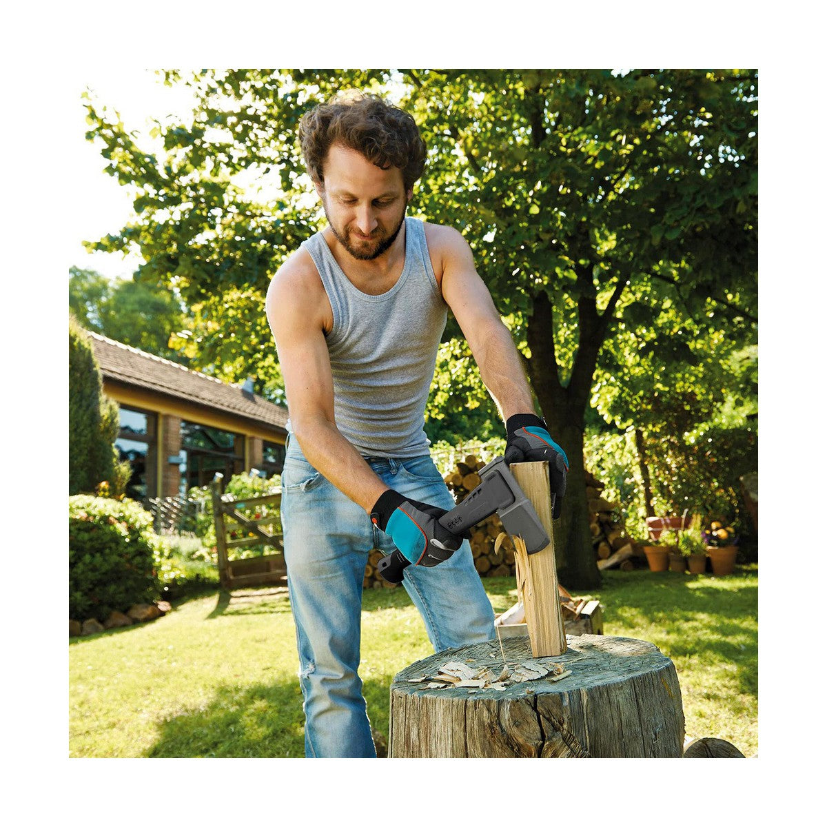 Man chopping wood with an axe in a garden setting