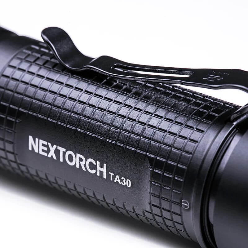BlackNextorch TA30 flashlight on a white background
