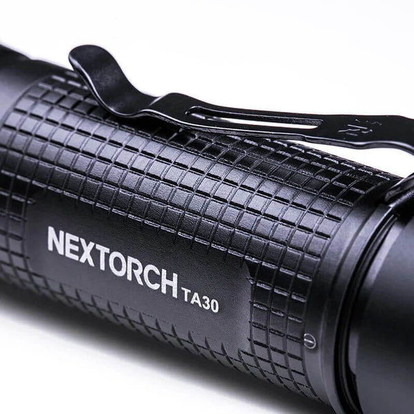 BlackNextorch TA30 flashlight on a white background