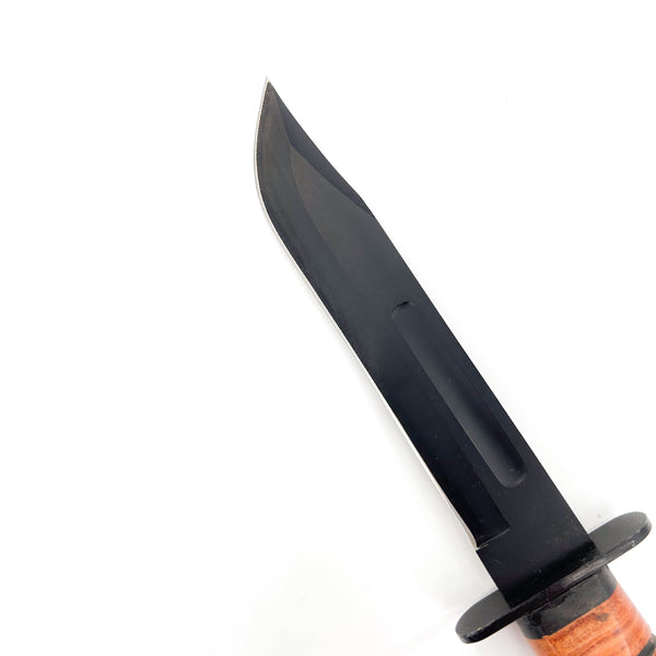 Black knife with a wooden handle on a white background
