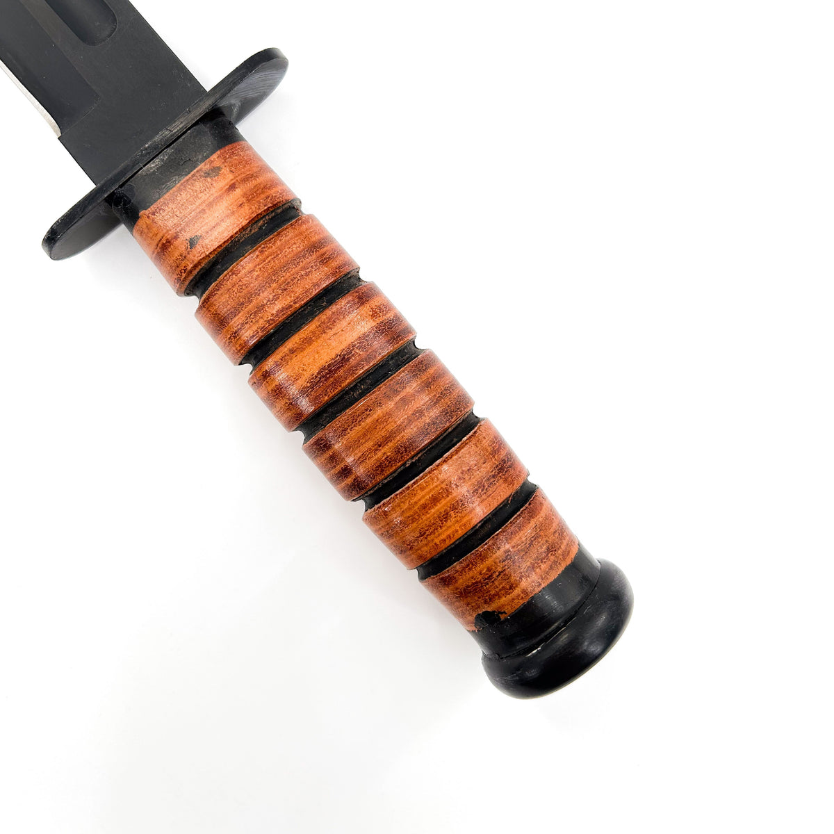 Wooden-handled knife with black blade on a white background