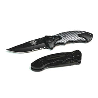 Folding knife with open blade and black handle on a white background