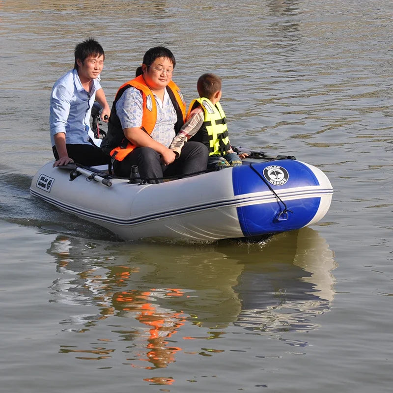 Three people on an inflatable boat with life vests in a body of water.