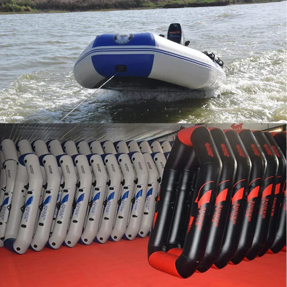 Inflatable boat being pulled by a rope on water with a row of similar boats and oars in the foreground.