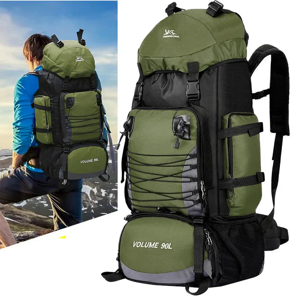Green hiking backpack with black straps and 'Volume 90L' label, shown with a person wearing it outdoors.