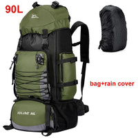 Green hiking backpack with rain cover on a white background