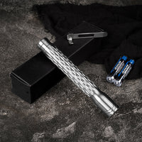 Metal tool with textured handle on a dark surface